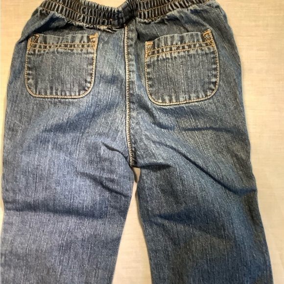 GYMBOREE blue jeans with red flowers and bows. Size 12-18 months. - Picture 4 of 5